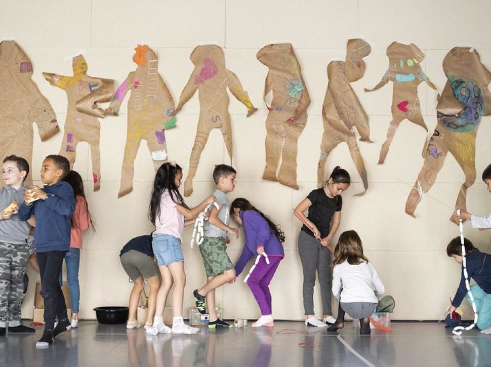 Claudia Solwat with 1st and 2nd-grade students from Pau Vila school